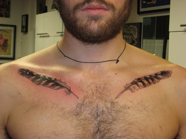 realistic-bird-feathers-chest-tattoo