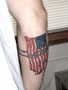 usa_flag_with_barbed_wire_tattoo_on_arm.jpg.pagespeed.ce.cdFnK9RF3z