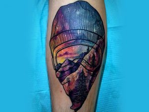 tatuaggi colorati ispirati alla natura montagna tramonto